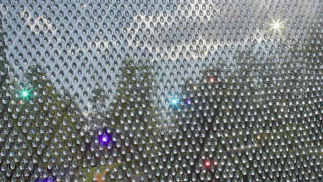 close up of a crystal curtain with light reflecting off the drops