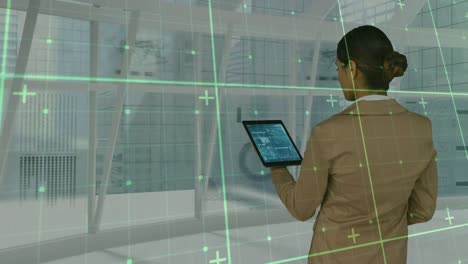 Animation-of-data-processing-over-businesswoman-using-tablet
