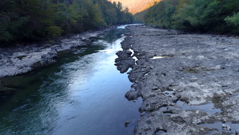 Flying-over-small-slow-running-river