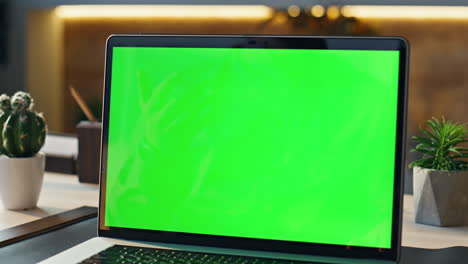 man chatting greenscreen computer in workplace closeup. worker having conference