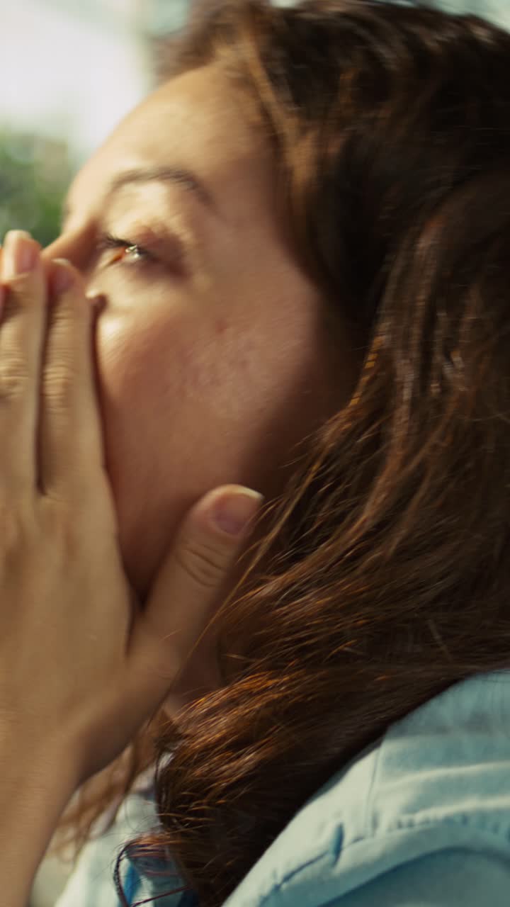 Vertical video Stressed employee at office desk feeling tired while editing documents