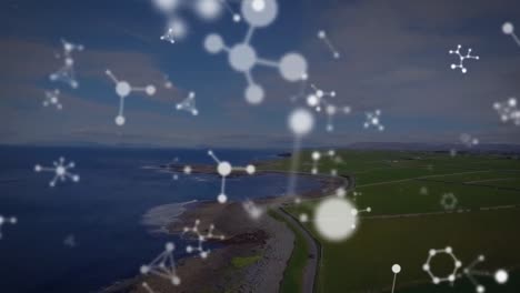 animation of falling molecules over seascape