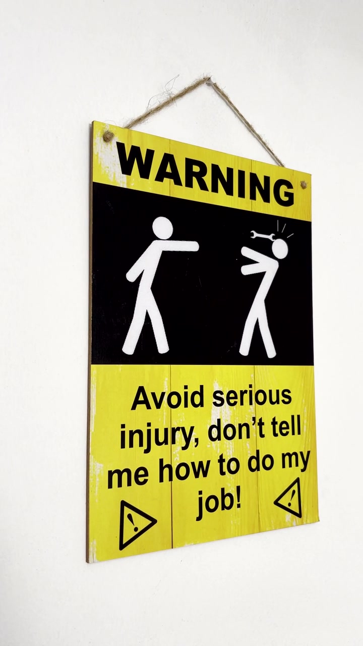 Funny signage on wall warning people to keep their opinions on how to do something to themselves to avoid getting hurt