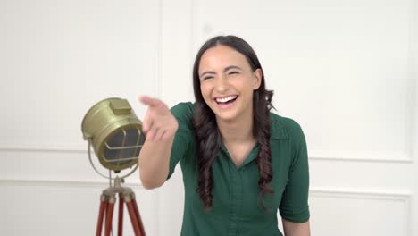 indian woman laughing on someone