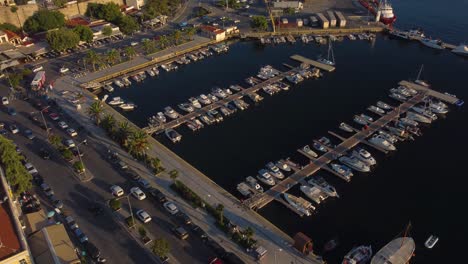 Aerial-ascend-over-port-with-docked-boats-in-summer-Greece