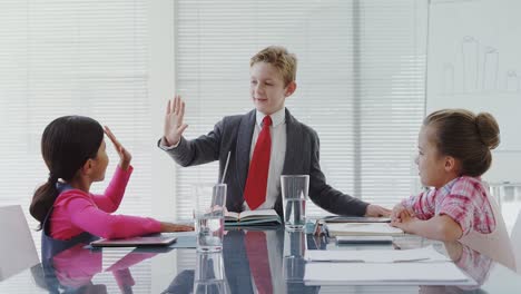 kids as business executives having a meeting in the board room 4k 4k