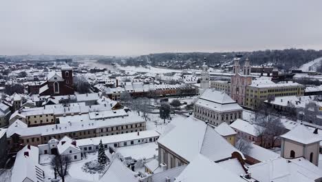 drone ascends and reveals beautiful downtown of kaunas city, lithuania