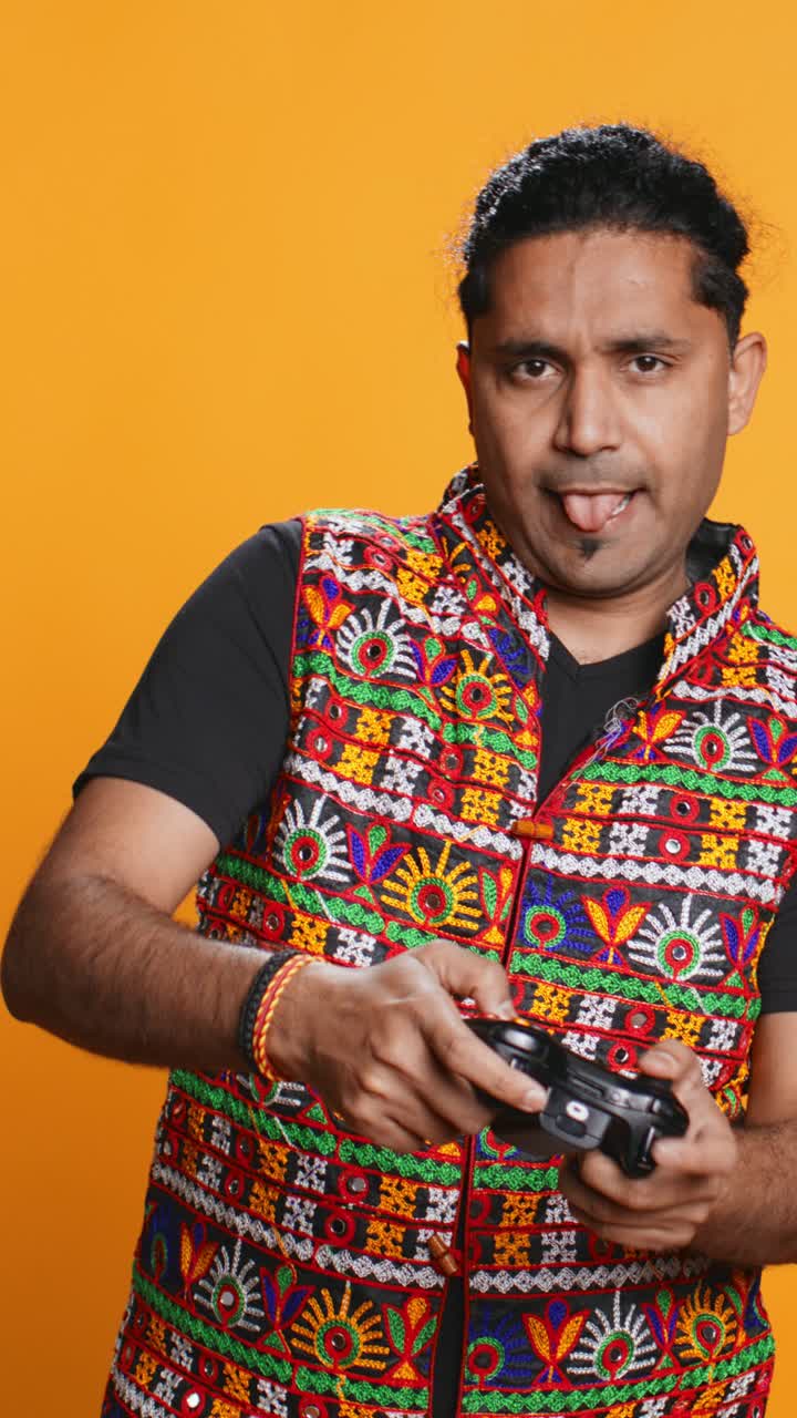 Man Playing Video Game with Controller and Showing Thumbs Up