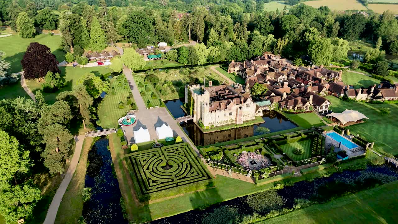 Experience the charm of Hever Castle with aerial drone footage showcasing its beautiful grounds, moat, and surrounding buildings. Ideal for heritage, travel, and cinematic content.