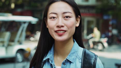 handheld video shows of vietnamese young woman in the city