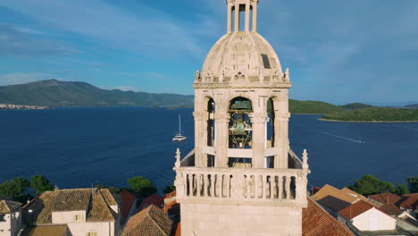 bell tower of cathedral in korcula old town in korcula island, croatia. - aerial closeup shot