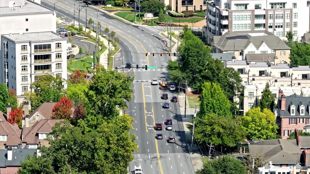 Traffic signal of urban metropolitan city road through residential neighbourhood, Peachtree road, North Buckhead, Atlanta, Georgia, Aerial