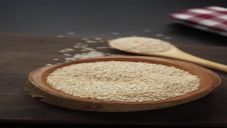 white sesame seeds in wooden bowl