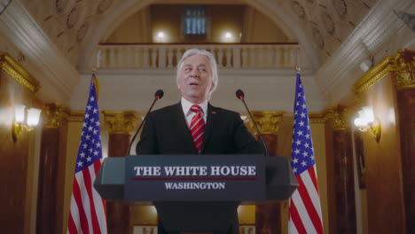 president of usa answers journalists questions and gives interview. confident american republican politician delivers successful speech to supporters at press conference. backdrop with american flags.