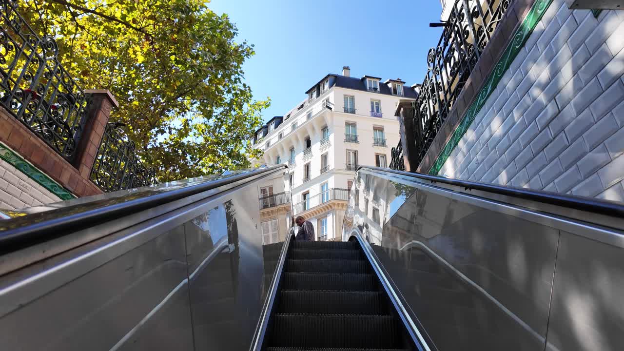 Metro exit view POV Paris France city buildings summer day Europe travel destination