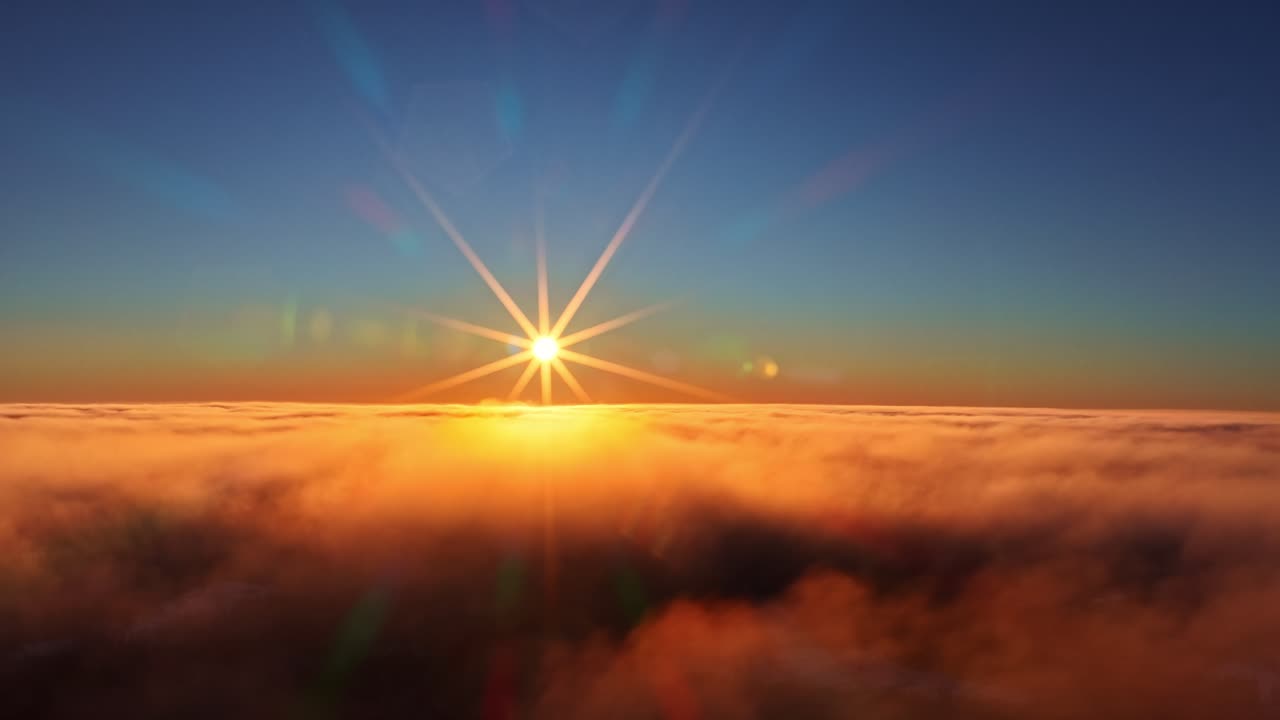 Luce solare dorata illumina le nuvole con una vibrante luce dell'alba o del tramonto, in una vista aerea sopra le nuvole