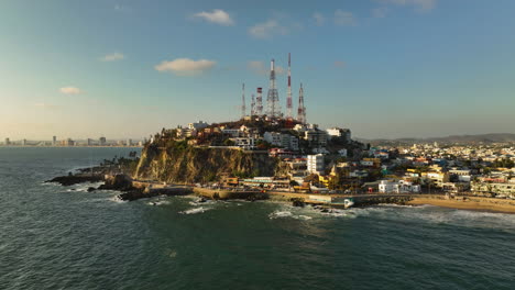 Aerial-view-around-the-Icebox-hill,-golden-hour-on-the-coast-of-Mazatlan,-Mexico