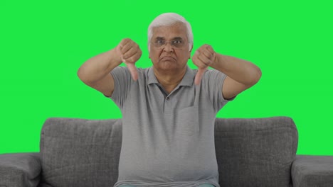 Frustrated-Indian-old-man-showing-thumbs-down-Green-screen