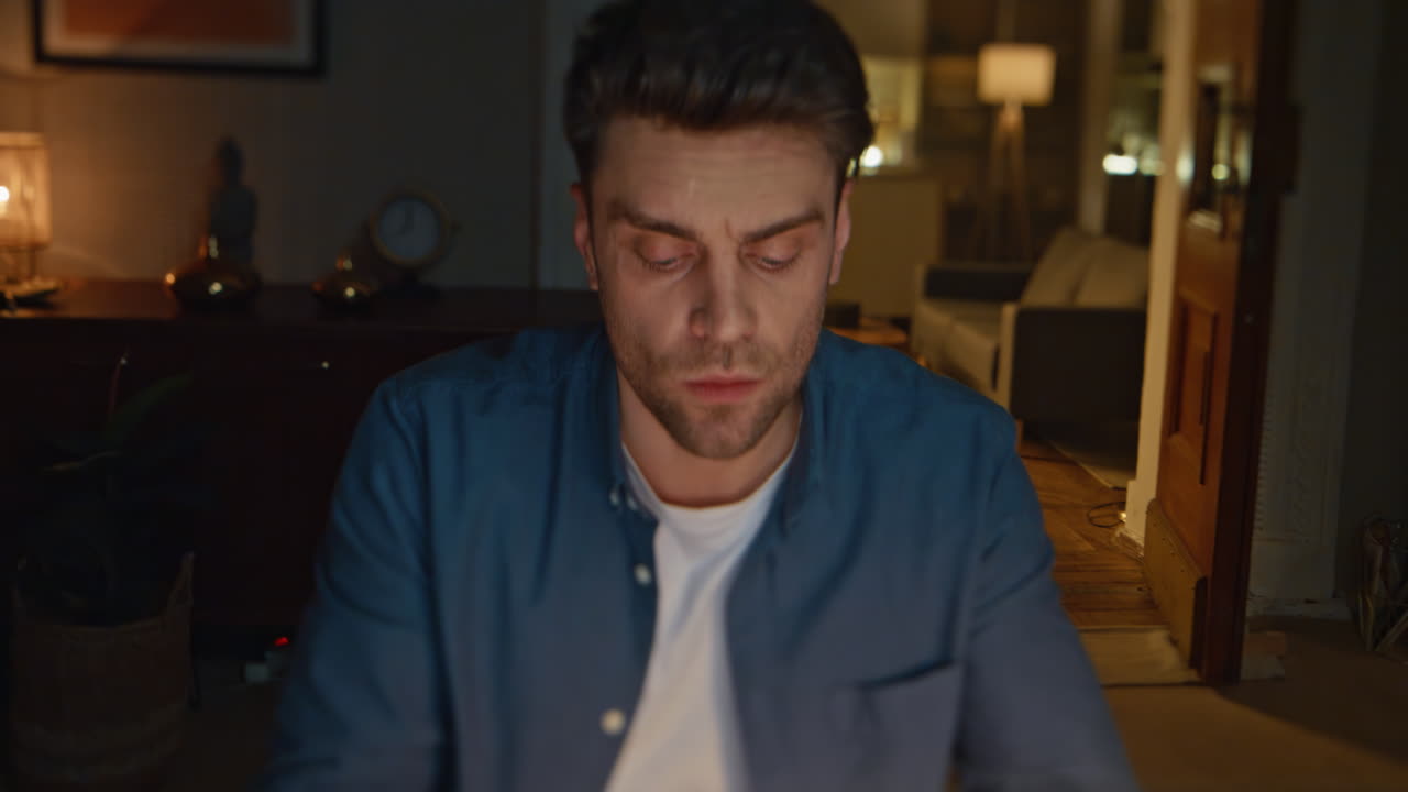 Overworked workaholic trying concentrate looking monitor at night flat closeup