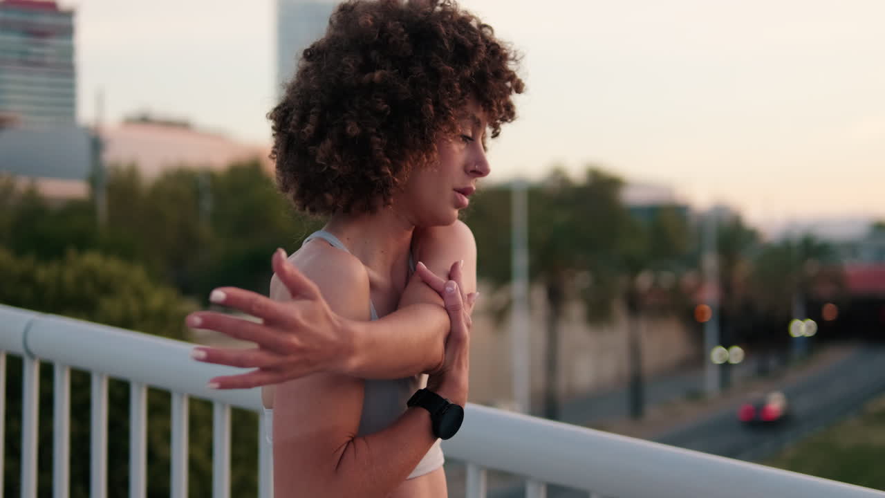 Fitness Woman Stretching on City Bridge