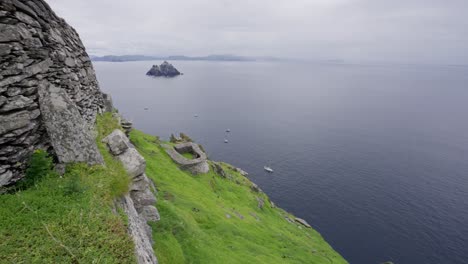 pan along the temple wall at the top of skellig michael in ireland