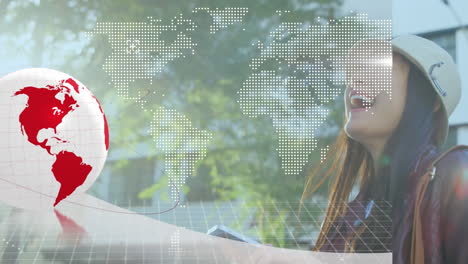 animation of computer circuit board, world map and globe over asian woman using smartphone