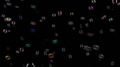 colorful soap bubbles fly out on the right side black background lot of bright colorful soap bubbles fly into the air on the right side black background