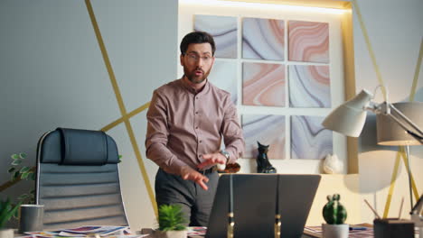 mad boss yelling laptop camera speaking on video conference. ceo arguing online