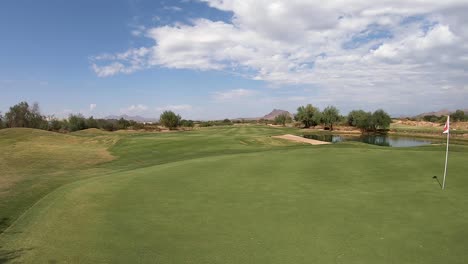 pan across a perfectly manicured green and flag, scottsdale, arizona