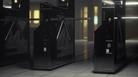 modern black turnstiles create a sleek entryway in a futuristic setting