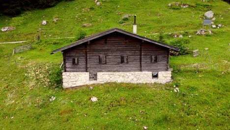 old wooden cottage in the austria alps - drone footage