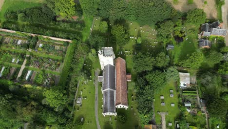 a quick top-down pan over holy cross church and cemetery in goodnestone