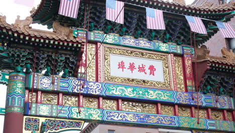 a detailed close-up of the colorful friendship gate adorned with american flags in chinatown, philadelphia.