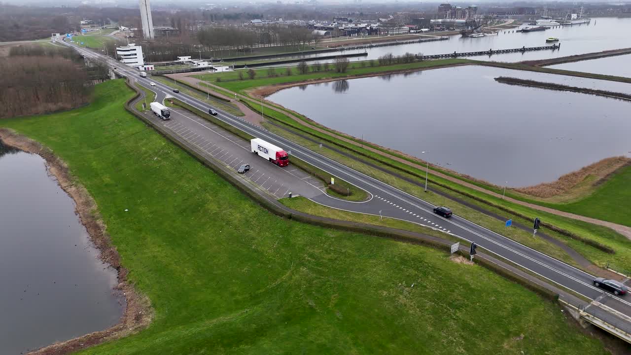 Aerial view of a road with traffic and water