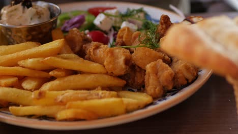 greek food, fork picks fries