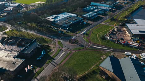 Aerial-hyperlapse-showing-buildings,-cars-and-city-landscape