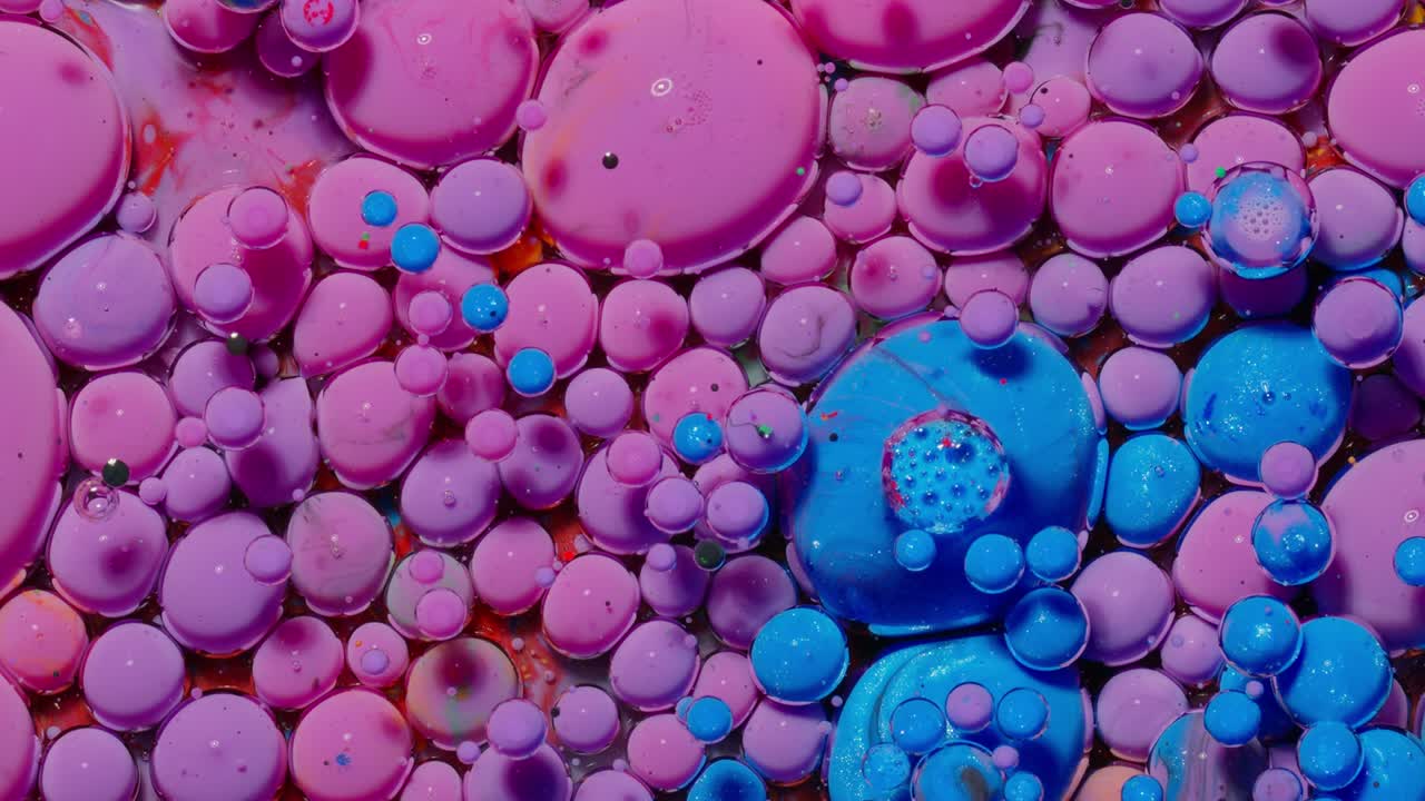 Macro structure of multicolored water paint oil bubbles movement, bright colorful acrylic painting