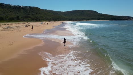 only a few people enjoying a clear summer day at putty beach nsw australia