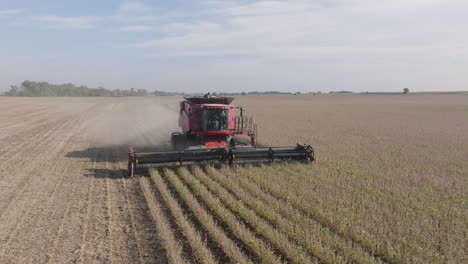 Frontal-Aerial-View-of-Combine-Harvester-Collecting-Dry-Soybeans-on-Farm