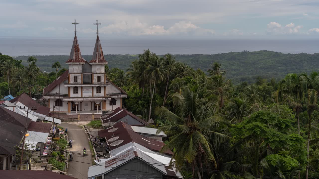 A church in a tropical village overlooking the ocean