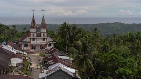 a church in a tropical village overlooking the ocean