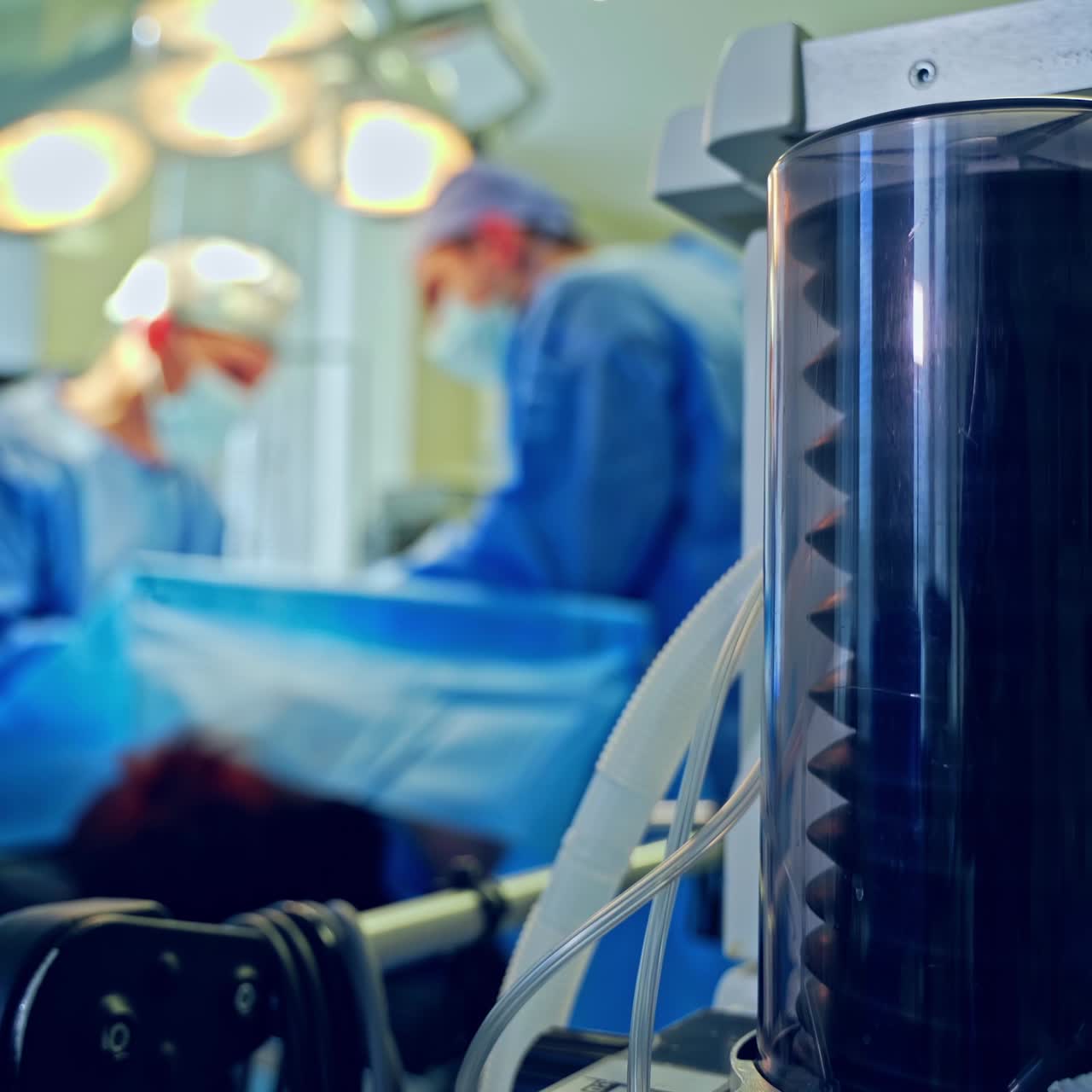 Modern medical equipment in the operating theater. Work of ventilator machine on the blur background of surgery process. Close-up.
