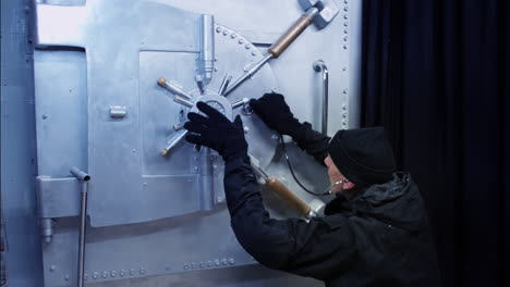 a safecracker breaking into a bank vault