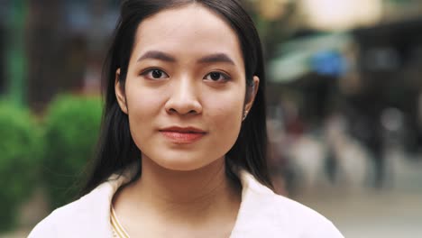 handheld view of smiling vietnamese woman