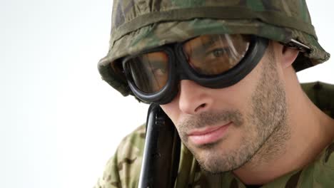 soldier aiming rifle on white background