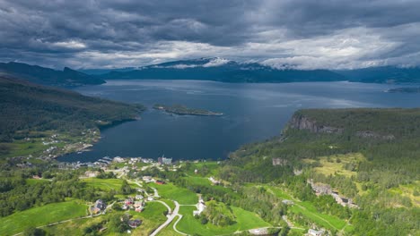 herand village seen from the above is located in a harbor neatly surrounded by rural roads, lush meadows, and hills