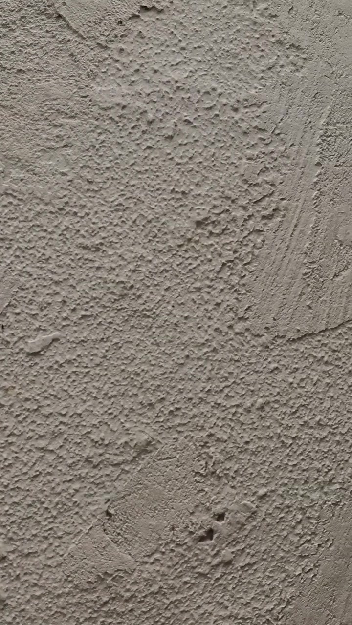 Rough textured concrete wall surface