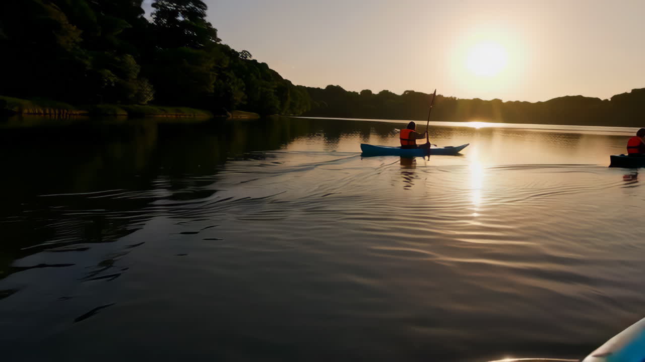 Kayaking at Sunset on a Calm Lake