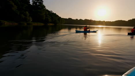 kayaking at sunset on a calm lake