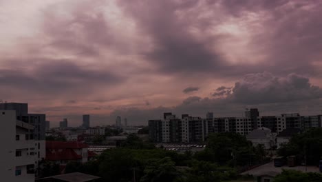 moody sunset skies sweep across bangkok’s distant skyline, timelapse